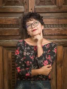 A woman stood in front of the door thinking